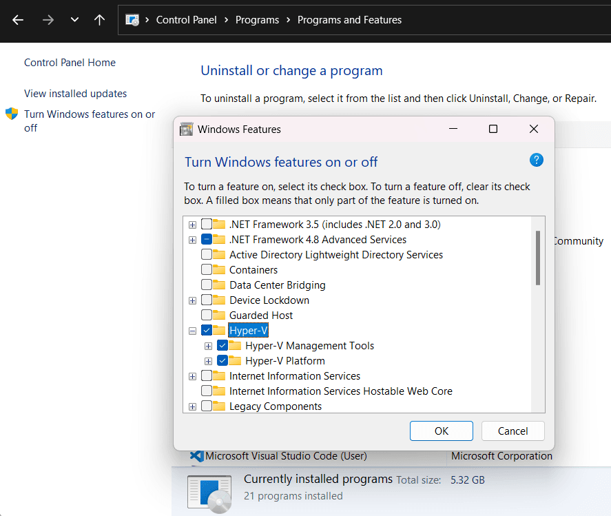 Windows Features dialog showing Hyper-V components selected